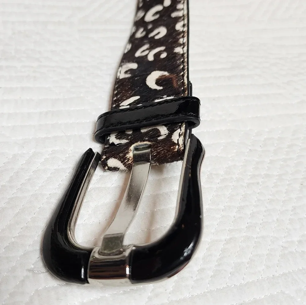 100% calf hair leather‎ dark brown, white spotted belt.